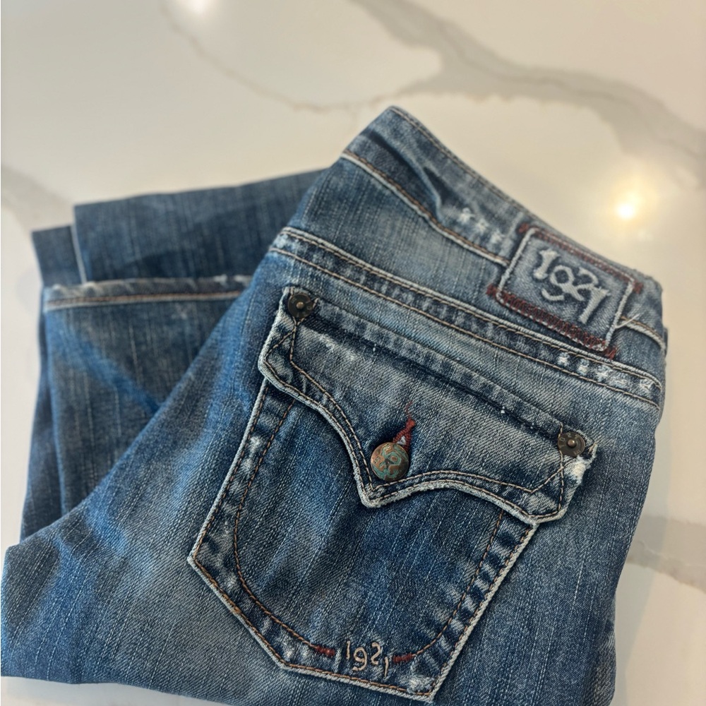 Blue Boot Cut Jeans with Subtle Fading